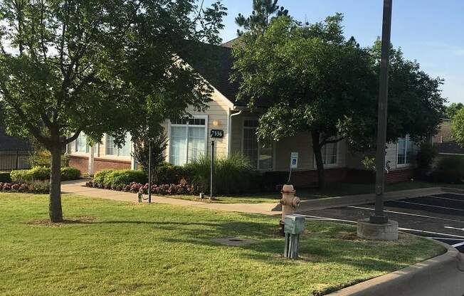 a lawn with a fire hydrant in front of a house at EDGEWOOD AT GABLES Apartments, TULSA ,74127