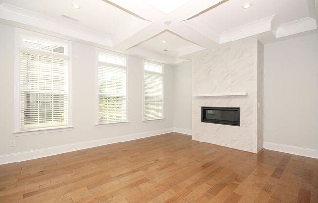 Beautiful John Wieland end unit townhouse never lived in, located in the heart of Waverly.