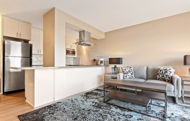 Renovated Living room and kitchen on the left with wood style floorings throughout