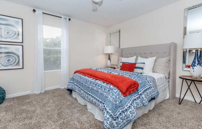 Bedroom with cozy bed at Royal Wildewood Manor Apartments, Clute, Texas