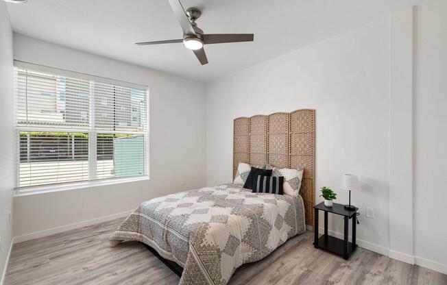 a bedroom with a bed in a room