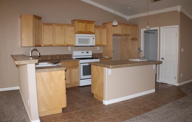 Charming 3-Bedroom Home with Fireplace, Spacious Backyard & Attached Garage in California City!