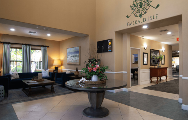 A lobby with a fountain and a sign that says Emerald Isle.