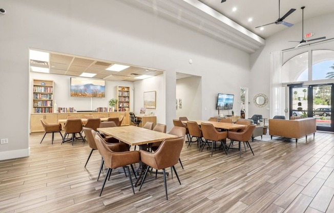 A room with a long table and chairs.
