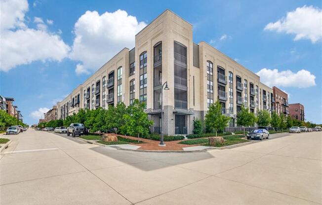A large building with a parking lot in front of it.