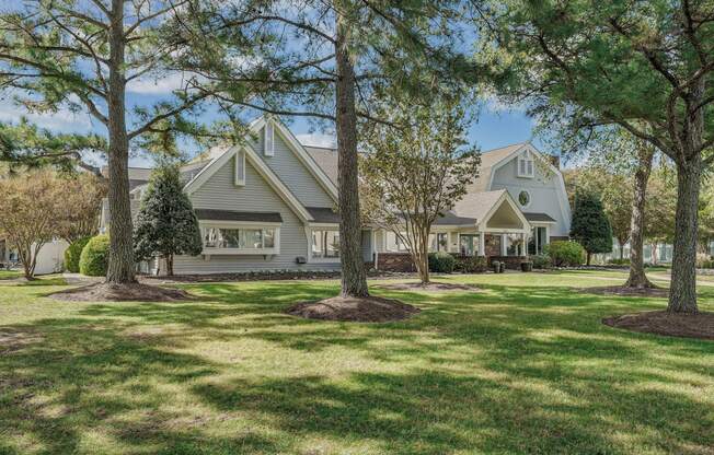 the exterior of a house with trees in the yard