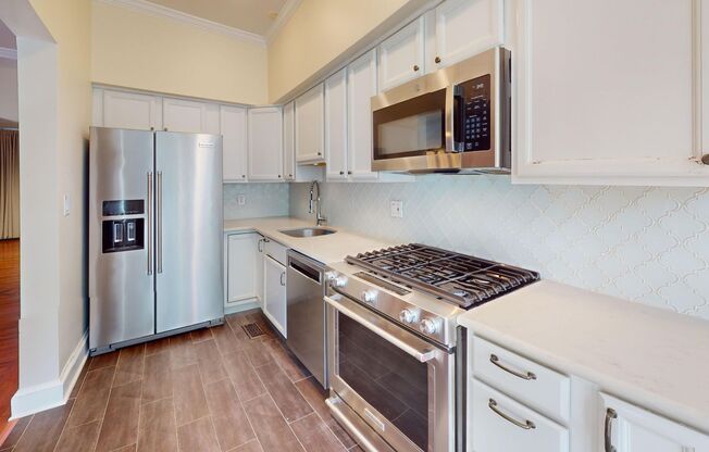 Spacious Three Bedroom Home W/Backyard, Back Deck, Front Porch, & Garage Parking