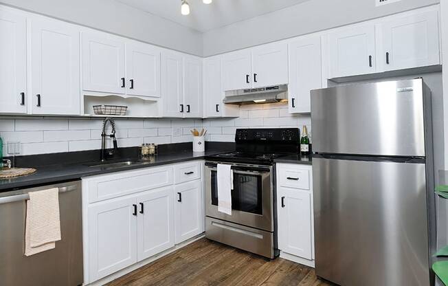 Apartments for Rent in Jacksonville, FL - Mandarin Bay Kitchen with Stainless Steel Appliances and Modern White Wood Cabinets