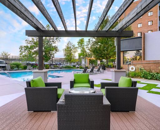 a pool and lounge area of a hotel with chairs at Alvista Nine Mile, North Carolina, 28803