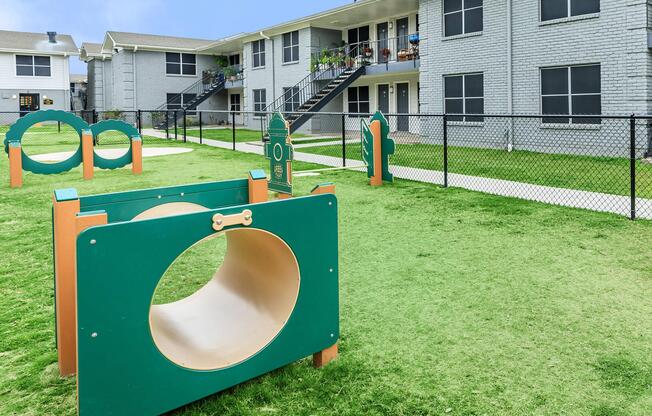 a green lawn in front of a building