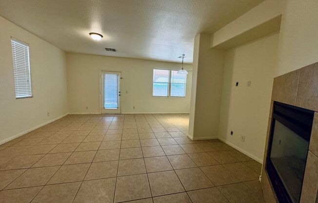 4 bedroom 3 bath home with separate family and living rooms! Tile and vinyl planks throughout as well as a large covered patio!