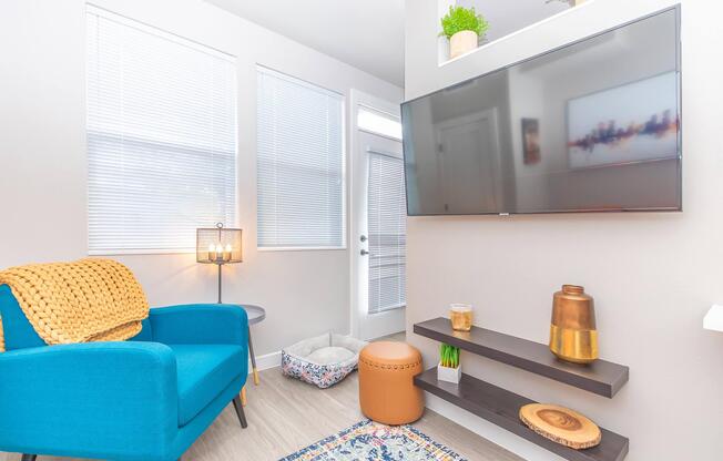 a living room filled with furniture and a large window
