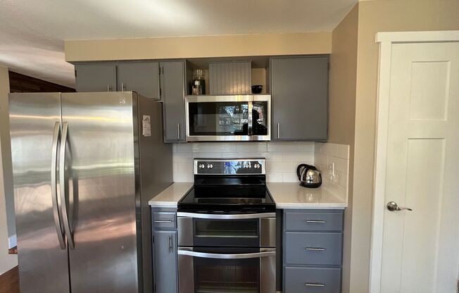 Astounding 3 bed 3 bathroom home in Beaverton! Updated kitchen& Bathrooms! Beautiful fenced Yard w/ RV Parking!
