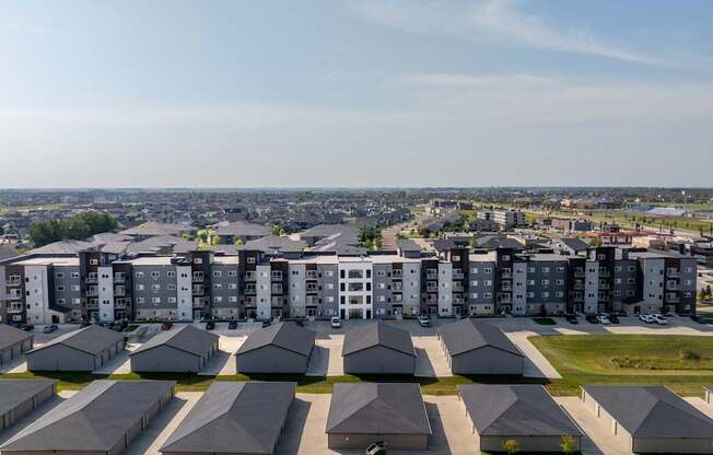 A large housing complex with multiple buildings and attached houses.