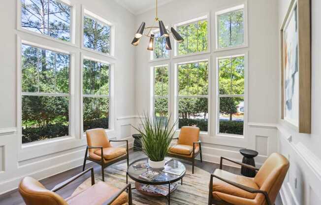 A sunny room with a table and chairs.