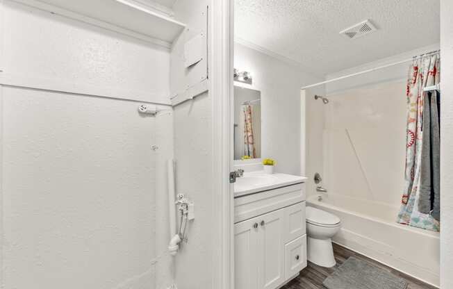 a bathroom with a sink toilet and a shower
