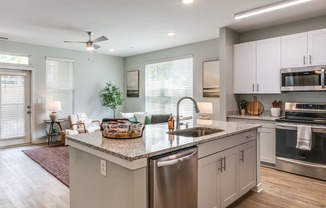 a large kitchen with a large island in the middle