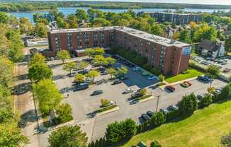 an aerial view of a parking lot in front of a building