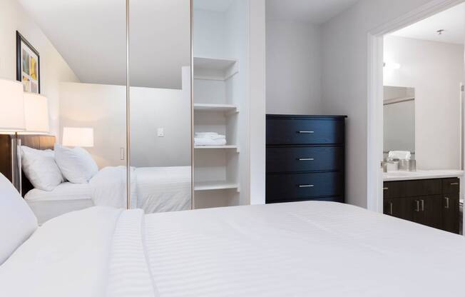 Sunnyvale CA Apartments - mResidences Silicon Valley - White Bedroom with Mirror-Closet and Attached Bathroom