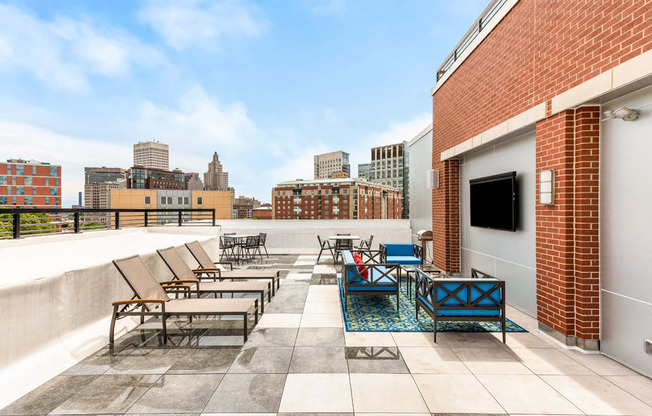 rooftop of station row with sun chairs and tv