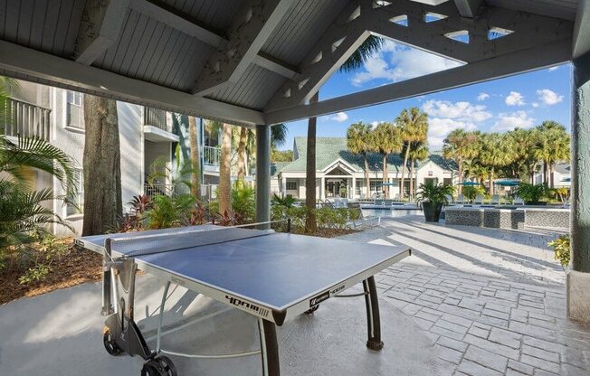 Covered Outdoor Ping Pong Table at Caribbean Breeze Apartments in Tampa, FL.
