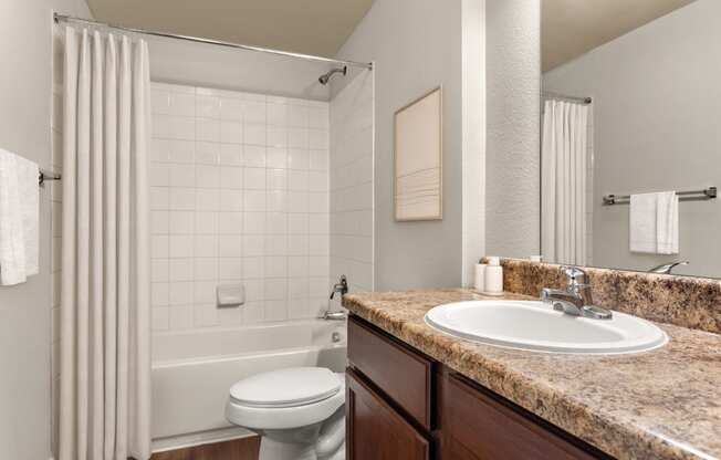 a bathroom with a bathtub and a sink