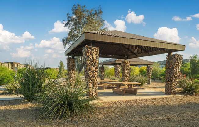 a picnic area with a picnic table and a pavilion