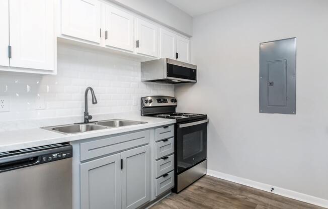 a kitchen with a stove and a sink