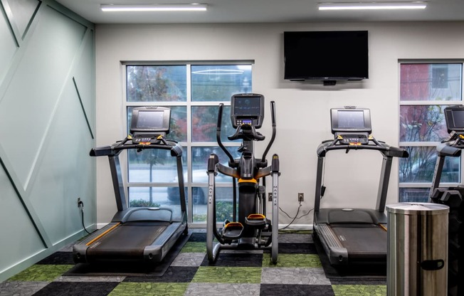 Treadmills In Gym at 310 at Nulu Apartments, Louisville, Kentucky