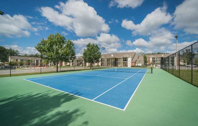 a row of tanks on a hill under a cloudy sky