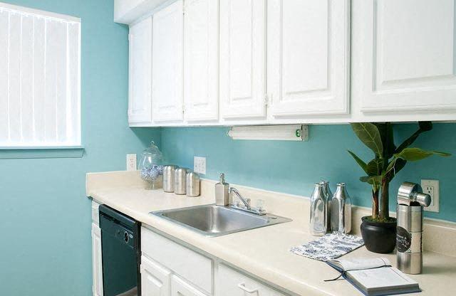 White cabinet kitchen at Emory Woods Apartments, Durham, NC.