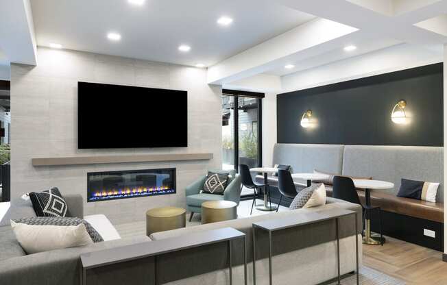 a living room with a fireplace and a large screen tv