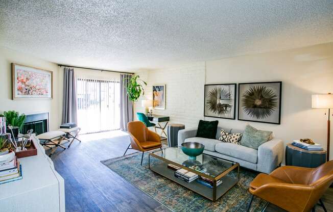the living room of an apartment with a couch and a coffee table