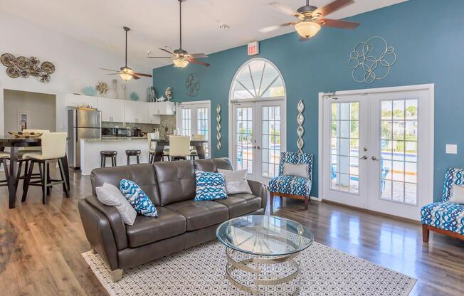 a view of a living room filled with furniture and a fire place