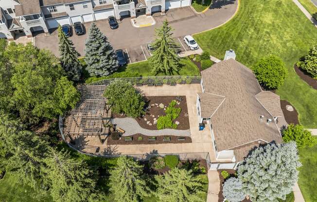 an aerial view of a home with a landscaped yard