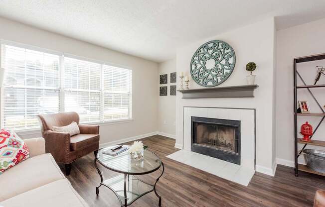 A living room with a fireplace and a couch.