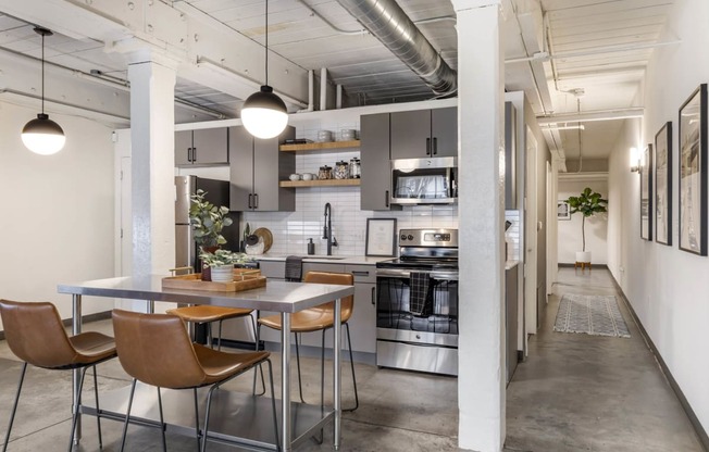 a kitchen and dining area in a loft at Highland Mill Lofts, Charlotte, North Carolina