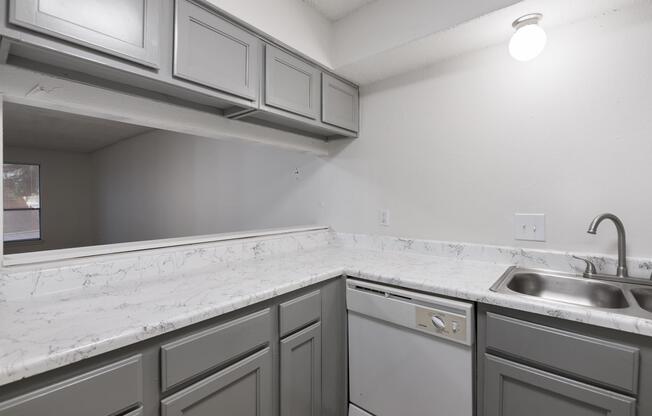 a kitchen with a stove and a sink