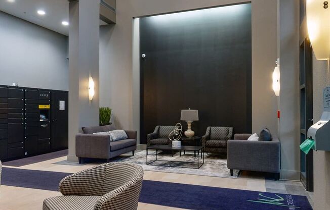 Sit back and relax in the modern lobby at Midtown Crossing Apartments in Omaha.