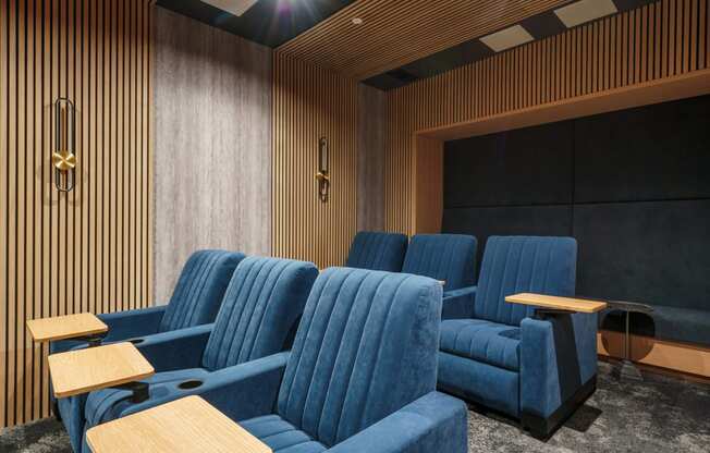 a room filled with blue chairs and tables