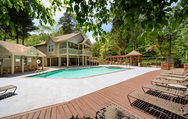 A large house with a pool in the backyard.