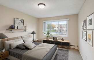 an empty bedroom with a large bed and a window