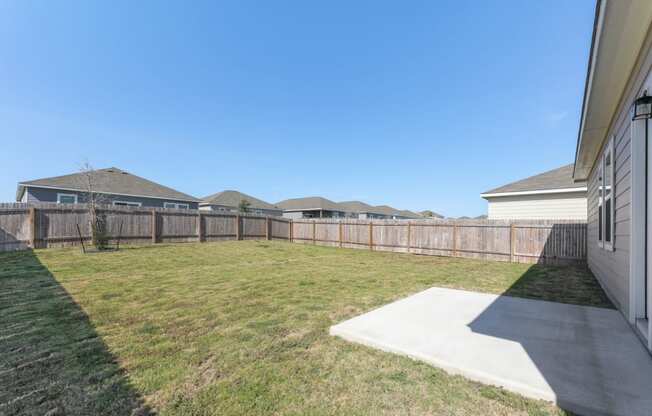 Spacious fenced backyard of Dogwood floor plan at Beacon at Presidential Heights in Manor, TX