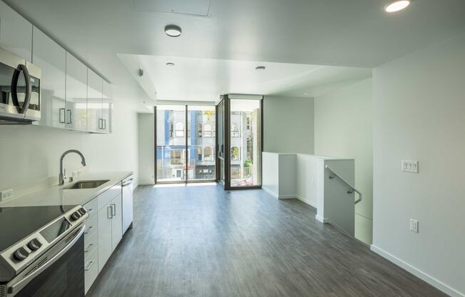 a kitchen and living room in an apartment