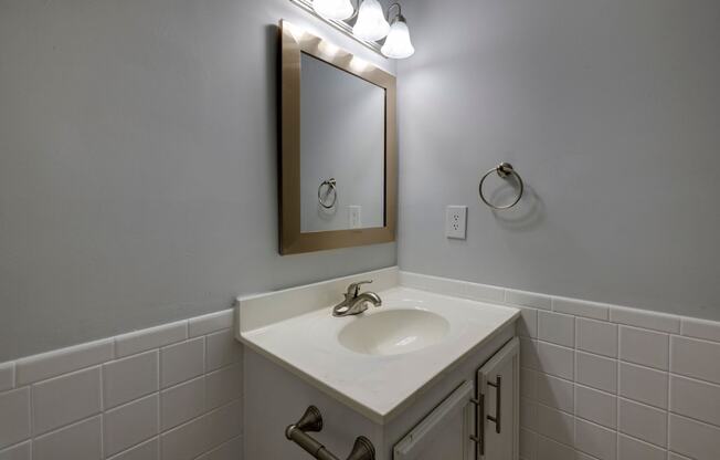 A bathroom sink with a mirror above it.