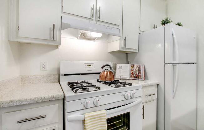 a kitchen with a stove top oven  at Sherway Villa, Reseda