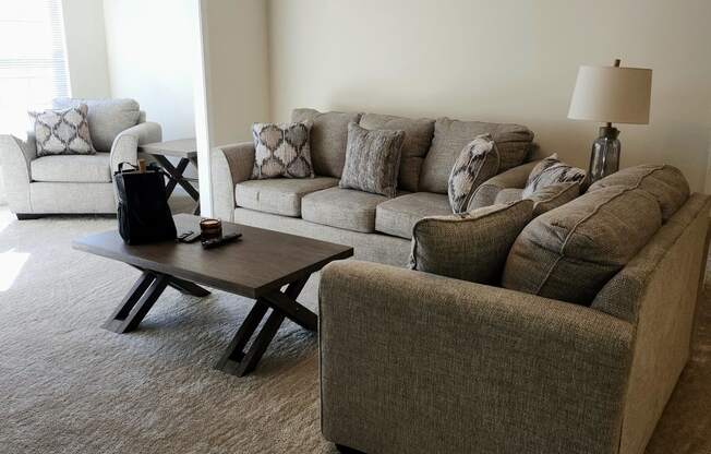 a living room with couches and a coffee table