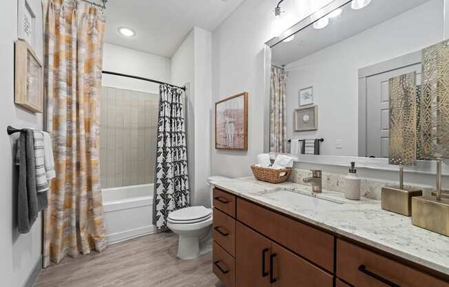a bathroom with a toilet and a sink in it