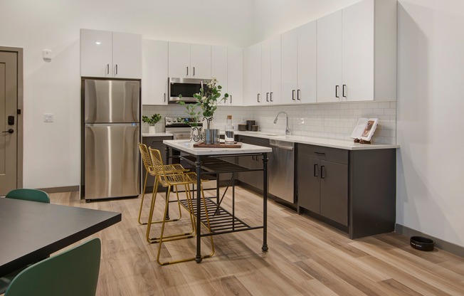 Chef-inspired kitchens feature stainless-steel appliances, sleek quartz countertops, and clean tile backsplashes.
