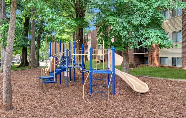 a playground with slides and chairs